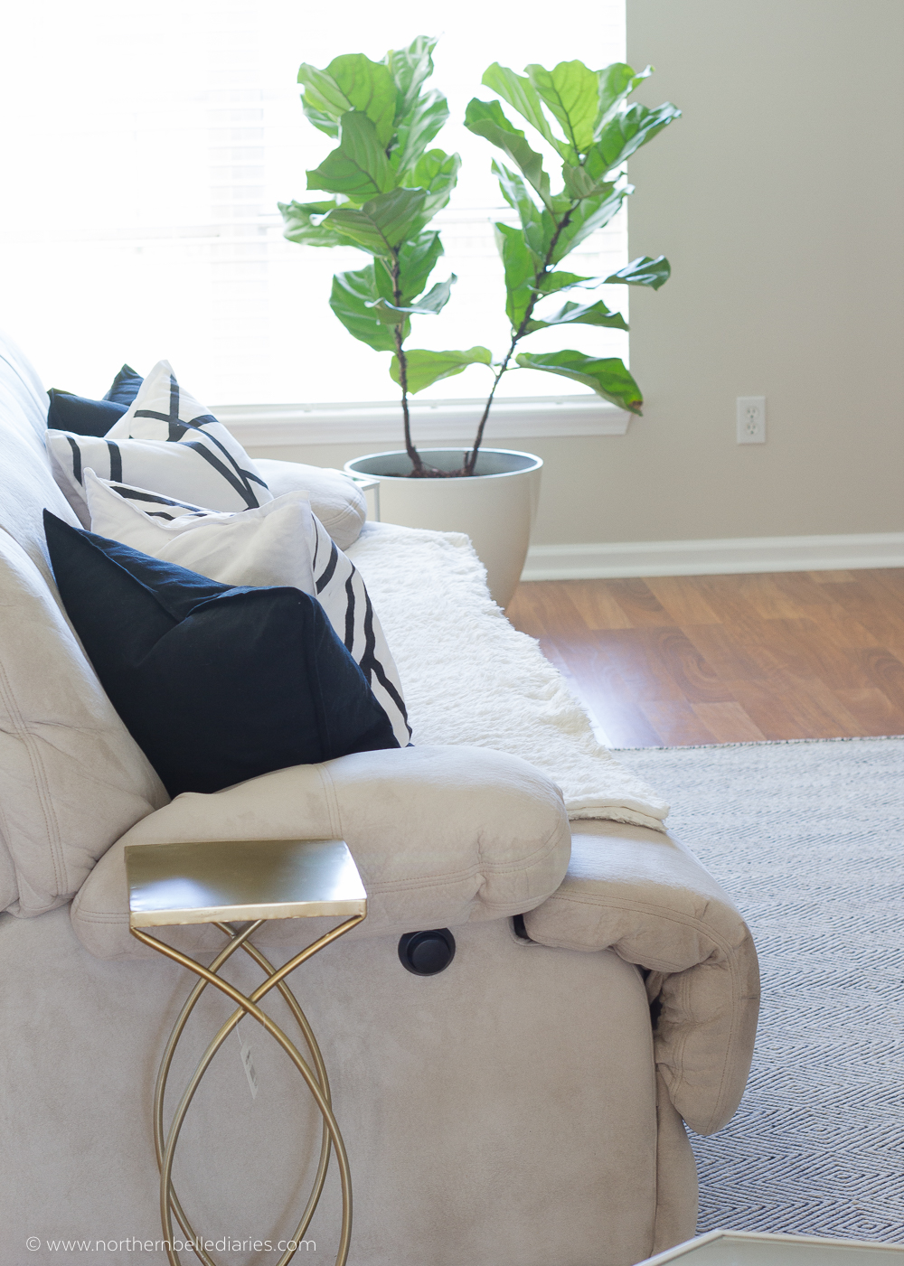 Black and white living room, leopard pillow, grey channels pillow, fiddle leaf fig, and Benjamin Moore Winds Breath