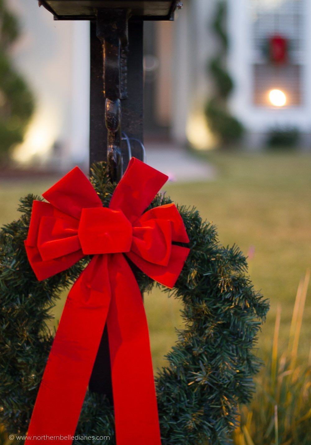 Classic Christmas wreaths with red ribbon on windows and mailbox post #christmas