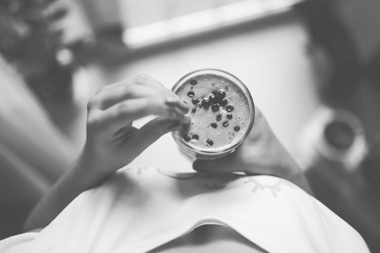 girl-drinking-blueberry-smoothie