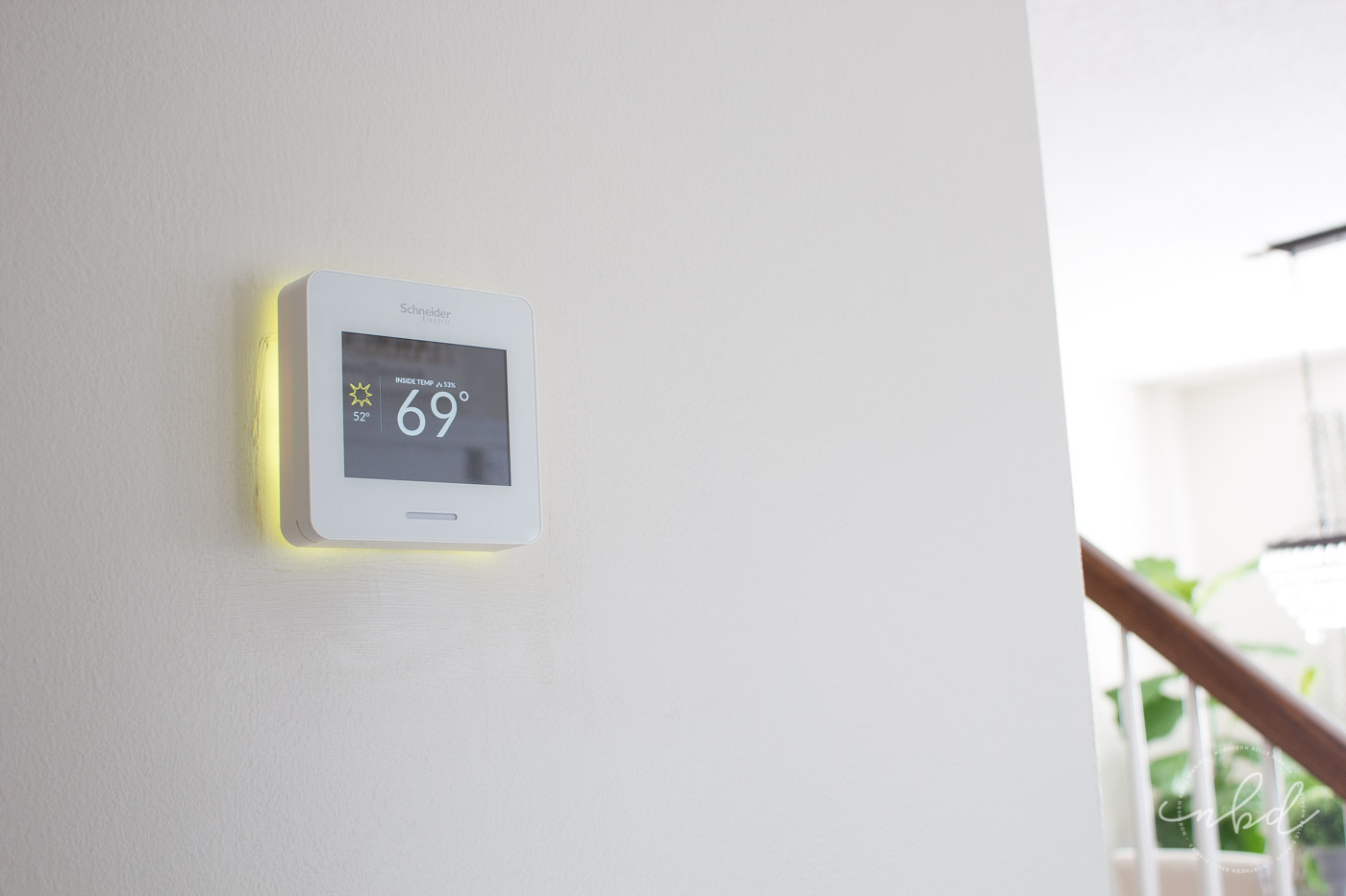 Wiser Air Wifi thermostat warming home. Yellow light
