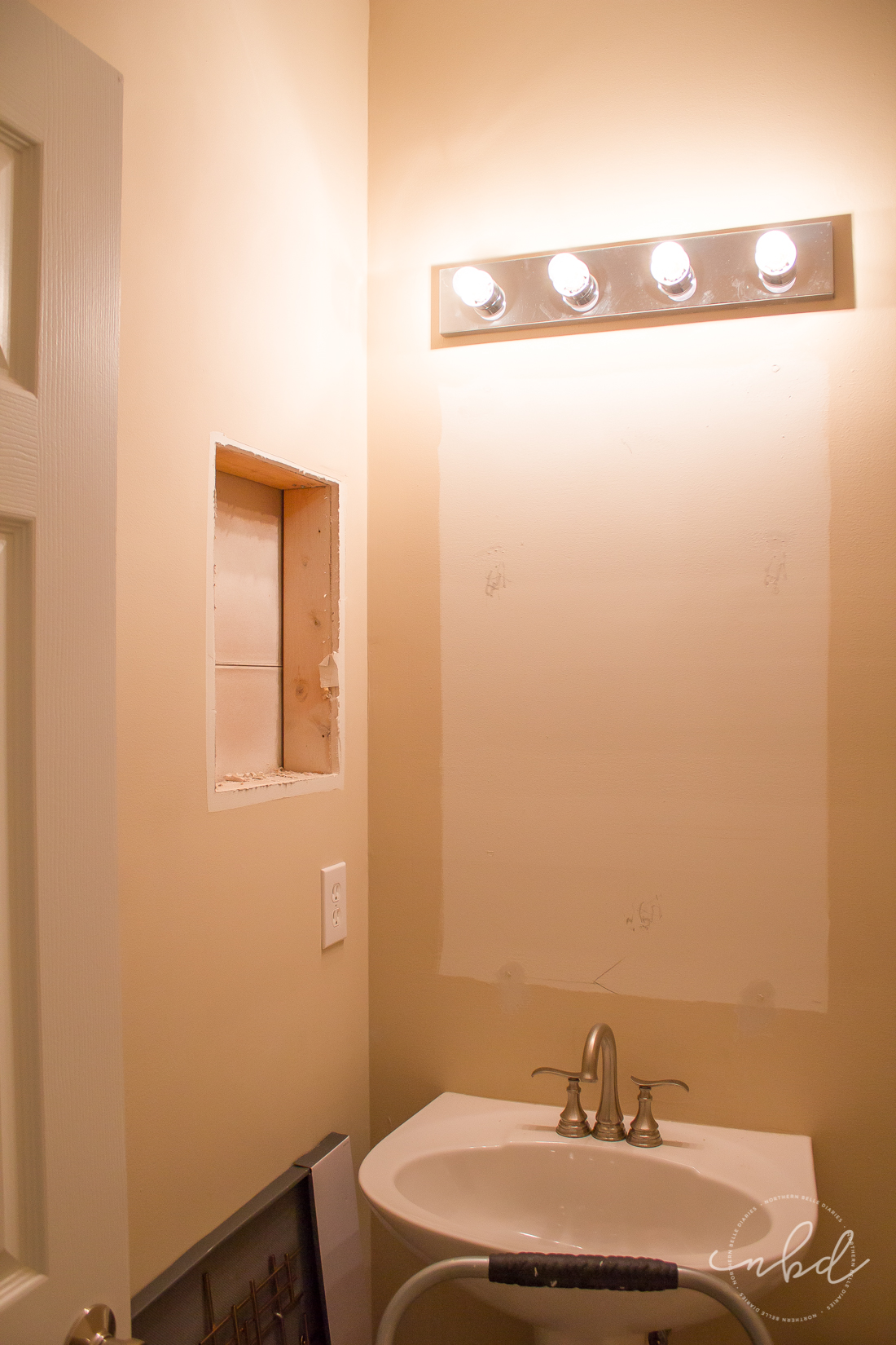 Elegant Half Bath on a Budget using Devine Color Wallpaper | removing builder-grade materials