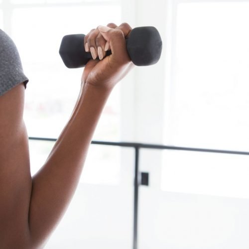 black woman weight lifting