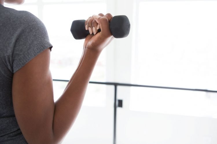 black woman weight lifting