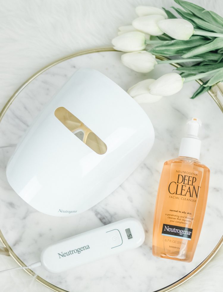 Neutrogena Light Therapy Acne Mask on marble tray with Neutrogena Deep Clean acne cleanser