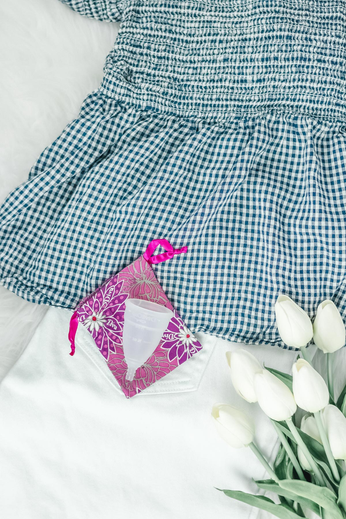 white jeans and gingham top with DivaCup menstrual cup