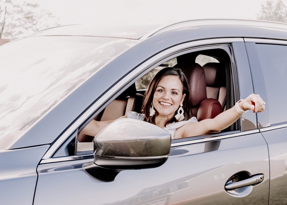 woman smiling in Mazda CX-9